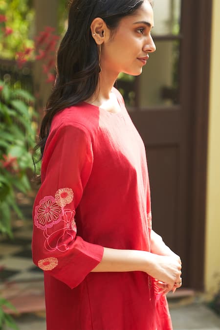 Shop Vaayu Red Muslin Embroidery Round Neck Asymmetric Bloom Applique Kurta Set Online at Aza Fashions Shop_Vaayu_Red Muslin Embroidery Round Neck Asymmetric Bloom Applique Kurta Set_Online_at_Aza_Fashions