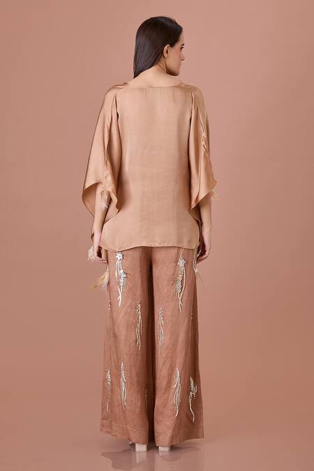 Shop Dilnaz Brown Blended Linen Embellished Feather Sequin Flared Trouser at Aza Fashions Shop_Dilnaz_Brown Blended Linen Embellished Feather Sequin Flared Trouser_at_Aza_Fashions