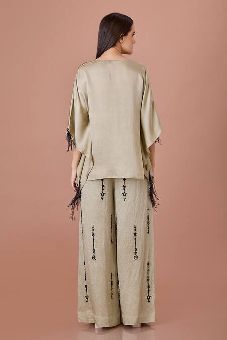 Shop Dilnaz Green Blended Linen Embellished Crystal Snowflake Flared Trouser at Aza Fashions Shop_Dilnaz_Green Blended Linen Embellished Crystal Snowflake Flared Trouser_at_Aza_Fashions