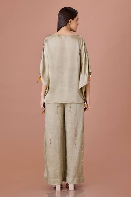 Shop Dilnaz Green Blended Linen Embellished Crystal Snowflake Flared Trouser at Aza Fashions Shop_Dilnaz_Green Blended Linen Embellished Crystal Snowflake Flared Trouser_at_Aza_Fashions