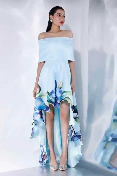 Buy Ozeqo White Neoprene Off-shoulder Asymmetric Orchid Print Dress With Cape Online at Aza Fashions Buy_Ozeqo_White Neoprene Off-shoulder Asymmetric Orchid Print Dress With Cape _Online_at_Aza_Fashions