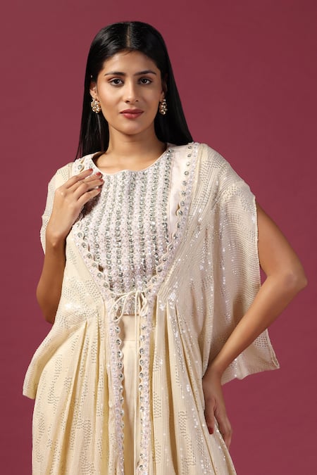 Two Sisters By Gyans_Ivory Georgette Sequins, Zari Round Neck Embroidered Cape Sharara Set _at_Aza_Fashions