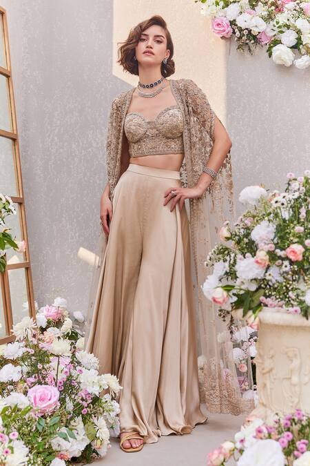 Saisha Beige Satin Sequins, Cut Work Sweetheart Neck Dori Embroidered Cape Sharara Set Online at Aza Fashions Saisha_Beige Satin Sequins, Cut Work Sweetheart Neck Dori Embroidered Cape Sharara Set _Online_at_Aza_Fashions