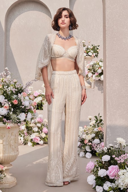 Shop Saisha Ivory Organza Pearls, Sequins, Beads Embroidered Cape And Bell Bottom Pant Set at Aza Fashions Shop_Saisha_Ivory Organza Pearls, Sequins, Beads Embroidered Cape And Bell Bottom Pant Set _at_Aza_Fashions