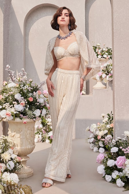 Buy Saisha Ivory Organza Pearls, Sequins, Beads Embroidered Cape And Bell Bottom Pant Set Online at Aza Fashions Buy_Saisha_Ivory Organza Pearls, Sequins, Beads Embroidered Cape And Bell Bottom Pant Set _Online_at_Aza_Fashions