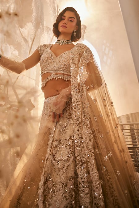 Swish By Dolcy And Simran Beige Net Cut Work, Pearls, Sequins, Feathers 3d Embroidered Bridal Lehenga Set Online at Aza Fashions Swish By Dolcy And Simran_Beige Net Cut Work, Pearls, Sequins, Feathers 3d Embroidered Bridal Lehenga Set _Online_at_Aza_Fashions