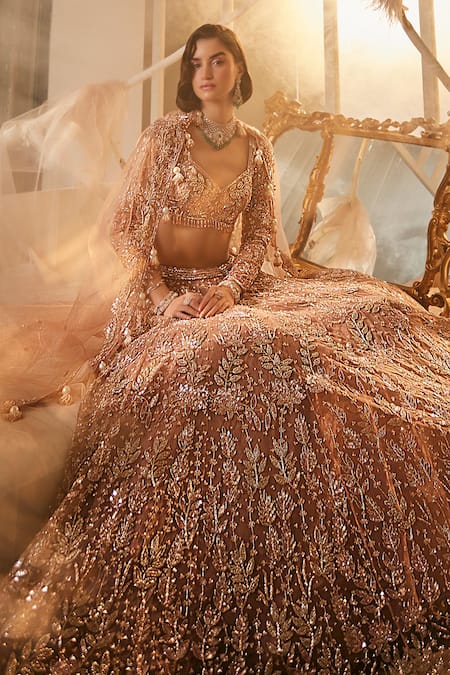 Swish By Dolcy And Simran Rose Gold Net Tassels, Embroidery Sweetheart Neck Cutdana Bridal Lehenga Set Online at Aza Fashions Swish By Dolcy And Simran_Rose Gold Net Tassels, Embroidery Sweetheart Neck Cutdana Bridal Lehenga Set _Online_at_Aza_Fashions