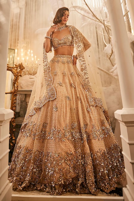 Swish By Dolcy And Simran Ivory Net Tassels, Crystals, Cut Work, Sequins, Floral Wave Lehenga Set Online at Aza Fashions Swish By Dolcy And Simran_Ivory Net Tassels, Crystals, Cut Work, Sequins, Floral Wave Lehenga Set _Online_at_Aza_Fashions