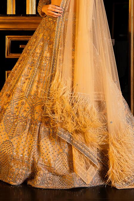 Ronak And Shruti Gold Net Sequins, Beads, Embroidery, Crystals, Glitter V-neck Bridal Lehenga Set Online at Aza Fashions Ronak And Shruti_Gold Net Sequins, Beads, Embroidery, Crystals, Glitter V-neck Bridal Lehenga Set _Online_at_Aza_Fashions