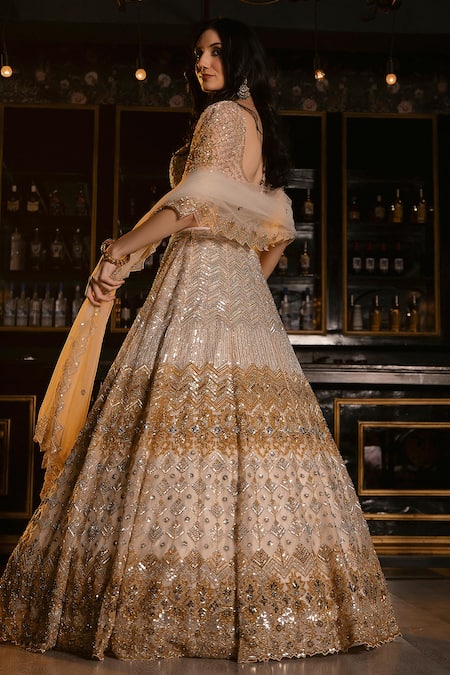 Shop Ronak And Shruti Gold Organza, Net Crystals, Cut Work, Sequins Ivory Embellished Lehenga Set at Aza Fashions Shop_Ronak And Shruti_Gold Organza, Net Crystals, Cut Work, Sequins Ivory Embellished Lehenga Set _at_Aza_Fashions