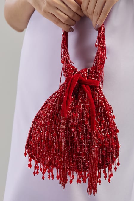 Tasna_Red Cut Work, Tassels Cutdana Potli Bag _at_Aza_Fashions