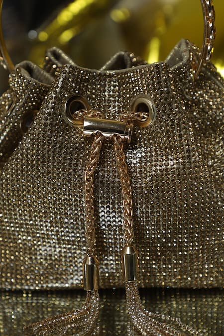 Shop_Be Chic_Gold Crystals, Tassels Embellished Potli _Online_at_Aza_Fashions