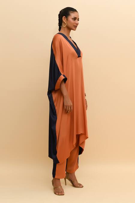 R. Y By Rishi And Vibhuti Orange Modal, Silk V-neck Asymmetric Kurta Set With Contrast Border Online at Aza Fashions R. Y By Rishi And Vibhuti_Orange Modal, Silk V-neck Asymmetric Kurta Set With Contrast Border_Online_at_Aza_Fashions