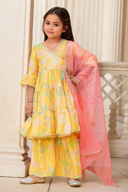 Petite Pomme Yellow Muslin, Net Tassels, Lace, Floral Printed Angarkha And Sharara Set at Aza Fashions Petite Pomme_Yellow Muslin, Net Tassels, Lace, Floral Printed Angarkha And Sharara Set _at_Aza_Fashions