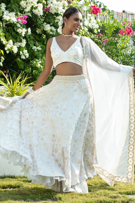 Monk & Mei By Sonia Anand_Ivory Silk, Brocade Pearls V-neck Floral Woven Lehenga Set _Online_at_Aza_Fashions