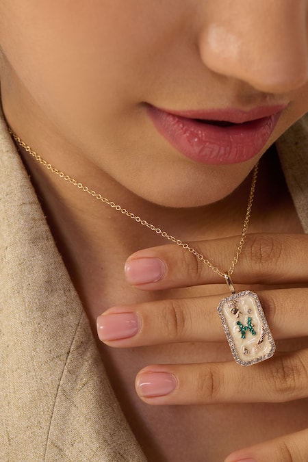 Shop Dusala Gold Plated Pisces Carved Pendant Necklace at Aza Fashions Shop_Dusala_Gold Plated Pisces Carved Pendant Necklace _at_Aza_Fashions