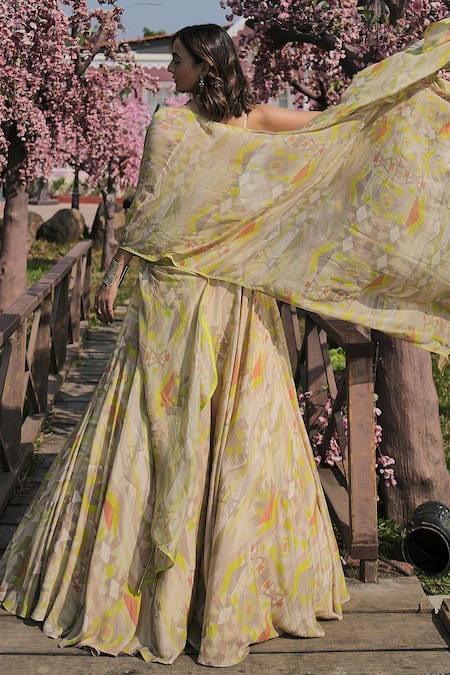 Shop Koswi Green Viscose Zari, Beads, Gota Patti Plunge Geometric Print Cape And Lehenga Set at Aza Fashions Shop_Koswi_Green Viscose Zari, Beads, Gota Patti Plunge Geometric Print Cape And Lehenga Set _at_Aza_Fashions