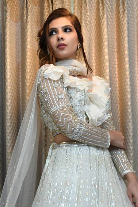 Buy_Ronak And Shruti_Ivory Net Feathers, Embroidery, Crystals, Sequins, Stones V-neck Lehenga Set _Online_at_Aza_Fashions