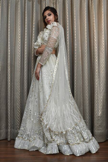 Ronak And Shruti_Ivory Net Feathers, Embroidery, Crystals, Sequins, Stones V-neck Lehenga Set _at_Aza_Fashions
