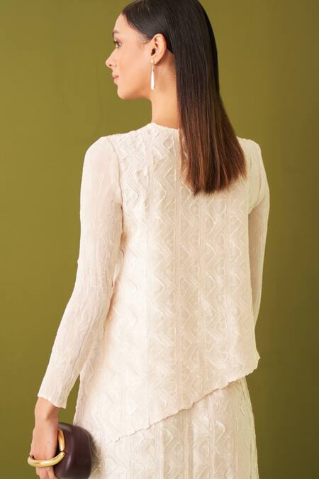 Shop Pleats By Aruni Ivory Crepe, Satin Embroidery Round Neck Textured Asymmetric Top And Skirt Set Online at Aza Fashions Shop_Pleats By Aruni_Ivory Crepe, Satin Embroidery Round Neck Textured Asymmetric Top And Skirt Set _Online_at_Aza_Fashions