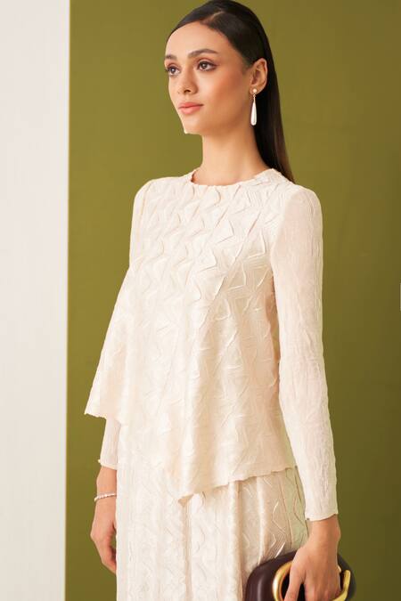 Pleats By Aruni Ivory Crepe, Satin Embroidery Round Neck Textured Asymmetric Top And Skirt Set at Aza Fashions Pleats By Aruni_Ivory Crepe, Satin Embroidery Round Neck Textured Asymmetric Top And Skirt Set _at_Aza_Fashions