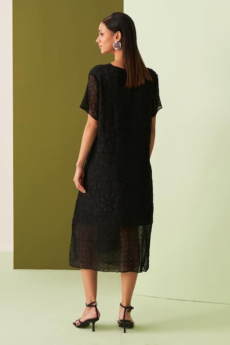 Shop Pleats By Aruni Black Cotton Embroidery Round Neck Flower Textured Midi Dress at Aza Fashions Shop_Pleats By Aruni_Black Cotton Embroidery Round Neck Flower Textured Midi Dress _at_Aza_Fashions