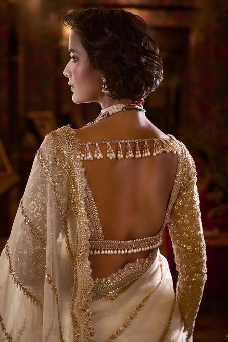 Buy Seema Gujral Ivory Organza, Silk Gota Patti, Pearls Plunge Neck Embroidered Saree Set Online at Aza Fashions Buy_Seema Gujral_Ivory Organza, Silk Gota Patti, Pearls Plunge Neck Embroidered Saree Set _Online_at_Aza_Fashions