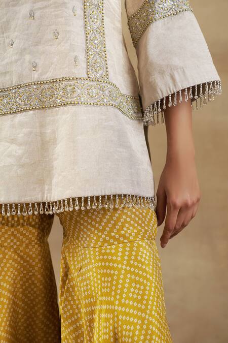 Shalkii Ivory Handloom Cotton, Chiffon Cut Work, Zardozi Embroidered Kurta Gharara Set at Aza Fashions Shalkii_Ivory Handloom Cotton, Chiffon Cut Work, Zardozi Embroidered Kurta Gharara Set _at_Aza_Fashions