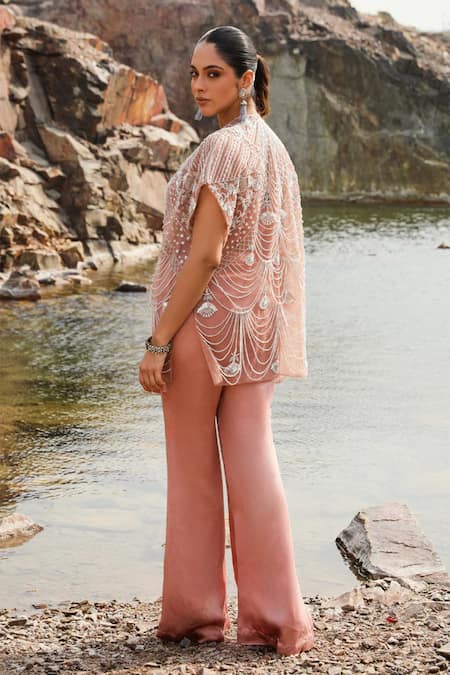 Label Moni K Peach Organza Cut Work, Sequins, Embroidered Cape Blouse And Bell Bottom Pant Online at Aza Fashions Label Moni K_Peach Organza Cut Work, Sequins, Embroidered Cape Blouse And Bell Bottom Pant _Online_at_Aza_Fashions