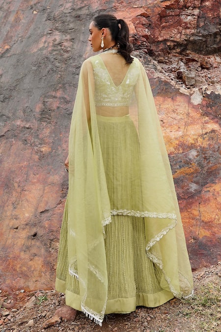 Shop Label Moni K Green Viscose, Organza, Crepe Embroidery V-neck Blossom Crushed Lehenga Set at Aza Fashions Shop_Label Moni K_Green Viscose, Organza, Crepe Embroidery V-neck Blossom Crushed Lehenga Set _at_Aza_Fashions
