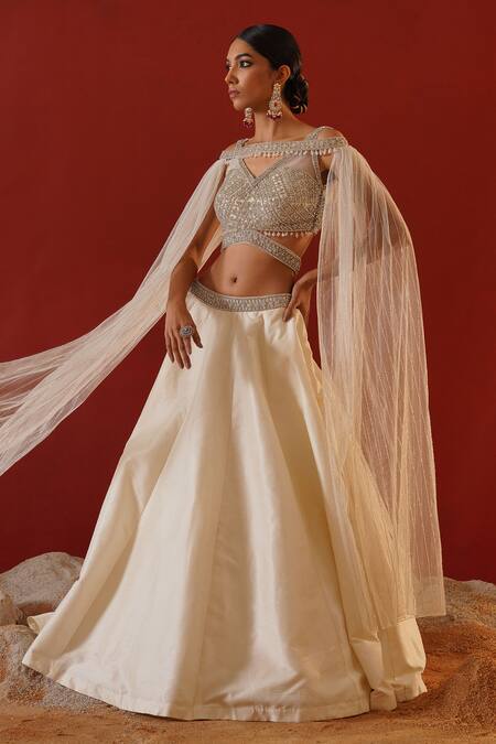 Shop Kapda Dori Ivory Silk, Net Sequins, Crystals Sweetheart Embroidered Lehenga And Cape Set Online at Aza Fashions Shop_Kapda Dori_Ivory Silk, Net Sequins, Crystals Sweetheart Embroidered Lehenga And Cape Set _Online_at_Aza_Fashions