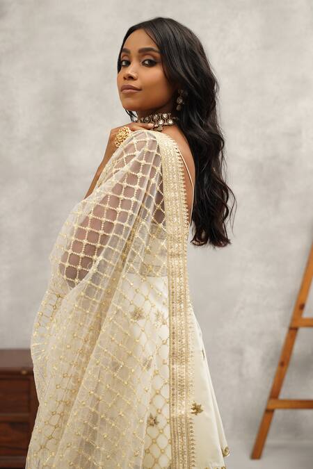 Kapda Dori White Net, Linen Zari, Sequins, Cut Work Floral Embroidered Peplum Kurta Set at Aza Fashions Kapda Dori_White Net, Linen Zari, Sequins, Cut Work Floral Embroidered Peplum Kurta Set _at_Aza_Fashions