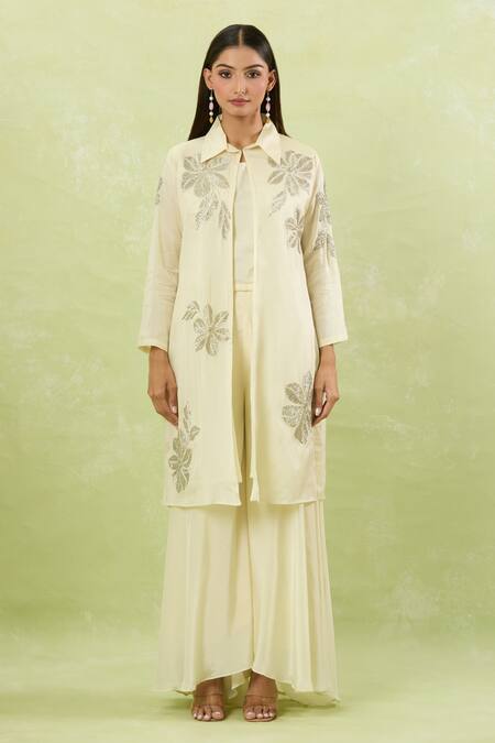 Shop Studio A Ivory Silk Cut Work Collared Cutdana Bloom Embroidered Jacket And Palazzo Set Online at Aza Fashions Shop_Studio A_Ivory Silk Cut Work Collared Cutdana Bloom Embroidered Jacket And Palazzo Set _Online_at_Aza_Fashions