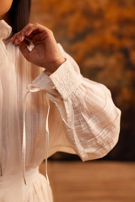 Shop Ahmev Ivory Cotton, Silk Embroidery Turtle Neck Chanderi Pleated Tie-up Shirt Online at Aza Fashions Shop_Ahmev_Ivory Cotton, Silk Embroidery Turtle Neck Chanderi Pleated Tie-up Shirt _Online_at_Aza_Fashions