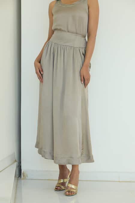 Shop Nirvanaa_Silver Solid Pleated Midi Skirt _Online_at_Aza_Fashions