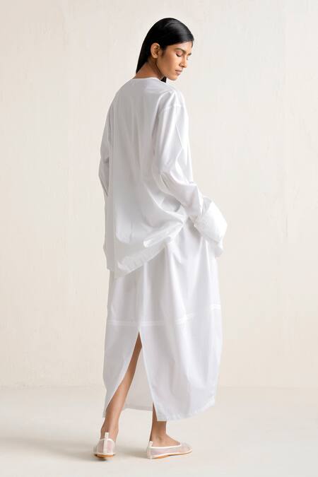 Shop Ituvana White Cotton Round Neck Button Down Shirt And Pear Shaped Skirt Set at Aza Fashions Shop_Ituvana_White Cotton Round Neck Button Down Shirt And Pear Shaped Skirt Set _at_Aza_Fashions