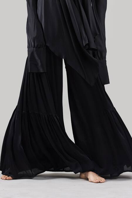 Buy Ituvana Black Silk Plunge Neck Cold Shoulder Top And Flared Pant Set Online at Aza Fashions Buy_Ituvana_Black Silk Plunge Neck Cold Shoulder Top And Flared Pant Set _Online_at_Aza_Fashions