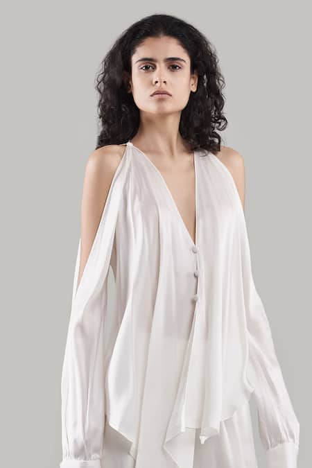 Shop Ituvana White Silk Plunge Neck Cold Shoulder Top And Flared Pant Set at Aza Fashions Shop_Ituvana_White Silk Plunge Neck Cold Shoulder Top And Flared Pant Set _at_Aza_Fashions