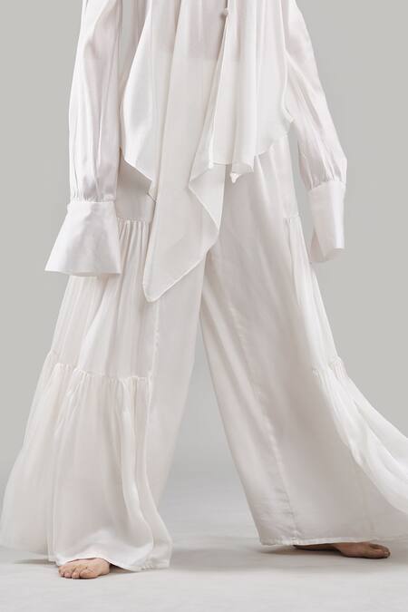 Ituvana White Silk Plunge Neck Cold Shoulder Top And Flared Pant Set Online at Aza Fashions Ituvana_White Silk Plunge Neck Cold Shoulder Top And Flared Pant Set _Online_at_Aza_Fashions