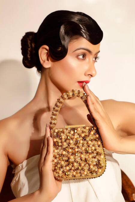 Shop_Bijoux By Priya Chandna_Gold Beads, Glitter, Stones Mini Pebble Handbag _Online_at_Aza_Fashions