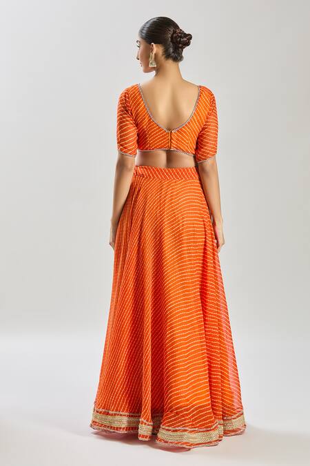 Shop Naintara Bajaj Orange Georgette Lace V-neck Embellished Lehenga Set at Aza Fashions Shop_Naintara Bajaj_Orange Georgette Lace V-neck Embellished Lehenga Set_at_Aza_Fashions