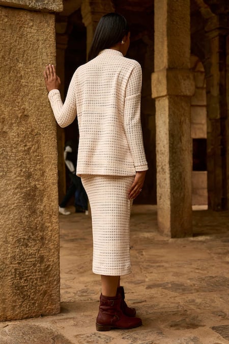 Shop Dash And Dot Ivory Polyester Shawl Neck Textured Knit Top And Midi Skirt Set at Aza Fashions Shop_Dash And Dot_Ivory Polyester Shawl Neck Textured Knit Top And Midi Skirt Set _at_Aza_Fashions