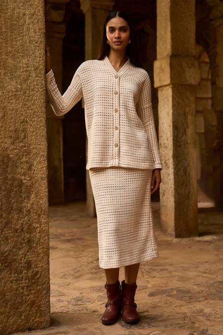 Shop Dash And Dot Ivory Polyester Shawl Neck Textured Knit Top And Midi Skirt Set Online at Aza Fashions Shop_Dash And Dot_Ivory Polyester Shawl Neck Textured Knit Top And Midi Skirt Set _Online_at_Aza_Fashions