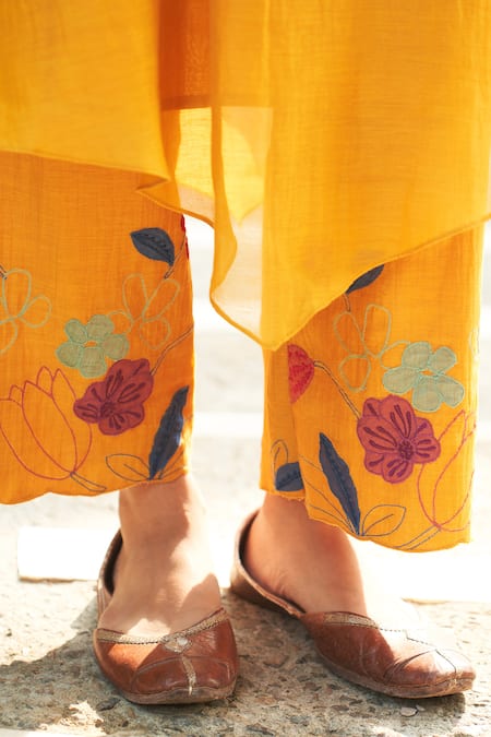 Vaayu Yellow Muslin Applique Round Neck Asymmetric Flared Sleeve Kurta And Pant Set Online at Aza Fashions Vaayu_Yellow Muslin Applique Round Neck Asymmetric Flared Sleeve Kurta And Pant Set _Online_at_Aza_Fashions