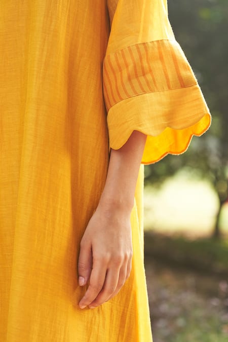 Vaayu Yellow Muslin Applique Round Neck Asymmetric Flared Sleeve Kurta And Pant Set at Aza Fashions Vaayu_Yellow Muslin Applique Round Neck Asymmetric Flared Sleeve Kurta And Pant Set _at_Aza_Fashions