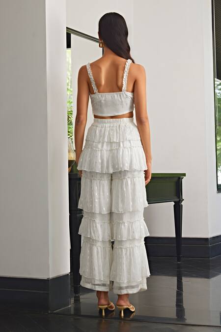 Shop Kay Kay White Chiffon, Lurex V-neck Tie-up Top And Frill Tiered Pant Set at Aza Fashions Shop_Kay Kay_White Chiffon, Lurex V-neck Tie-up Top And Frill Tiered Pant Set _at_Aza_Fashions