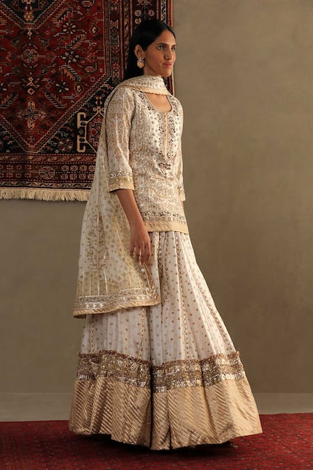 RI.Ritu Kumar Off White Silk, Chanderi Gota Patti Round Neck Embroidered Kurti Sharara Set Online at Aza Fashions RI.Ritu Kumar_Off White Silk, Chanderi Gota Patti Round Neck Embroidered Kurti Sharara Set _Online_at_Aza_Fashions