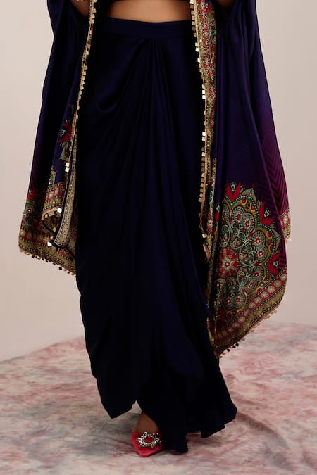 Surkh Syahi Blue Cotton, Silk Embroidery Collared Tribal Bloom Print Cape And Draped Skirt Set at Aza Fashions Surkh Syahi_Blue Cotton, Silk Embroidery Collared Tribal Bloom Print Cape And Draped Skirt Set _at_Aza_Fashions