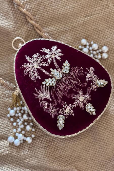 Shop Bhavna Kumar Wine Embroidery, Pearls Velvet Tasseled Clutch at Aza Fashions Shop_Bhavna Kumar_Wine Embroidery, Pearls Velvet Tasseled Clutch_at_Aza_Fashions