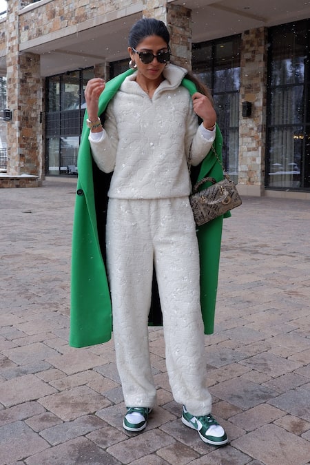 Shop Kay Kay White Polyester, Cotton Sequins High Faux Fur Embroidered Sweatshirt And Pant Set at Aza Fashions Shop_Kay Kay_White Polyester, Cotton Sequins High Faux Fur Embroidered Sweatshirt And Pant Set _at_Aza_Fashions
